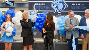 Dr. McCord and Principal Campbell clapping as they celebrate the ribbon cutting.