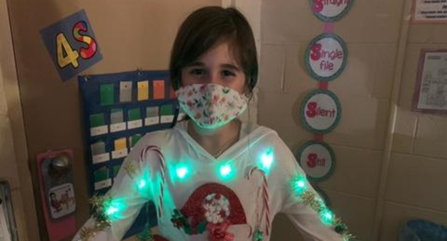 student in ugly Christmas sweater