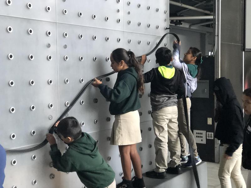 Students conduct an experiment in gravity