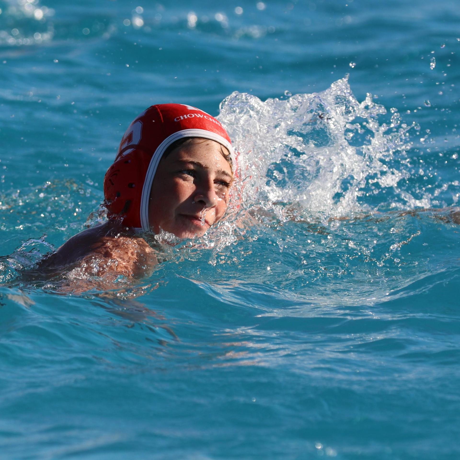boys playing water polo against Madera