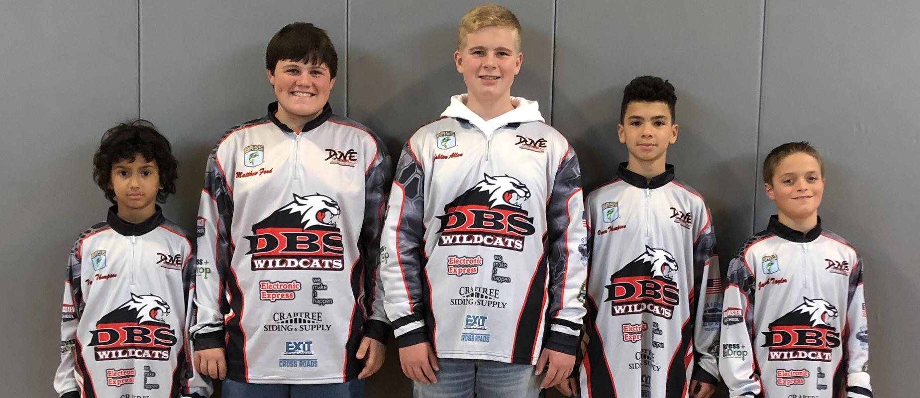 5 member of the fishing team wear their new jerseys