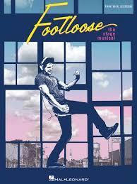  Footloose Logo, Man standing in front of window panes, playing air guitar, listening to headphones