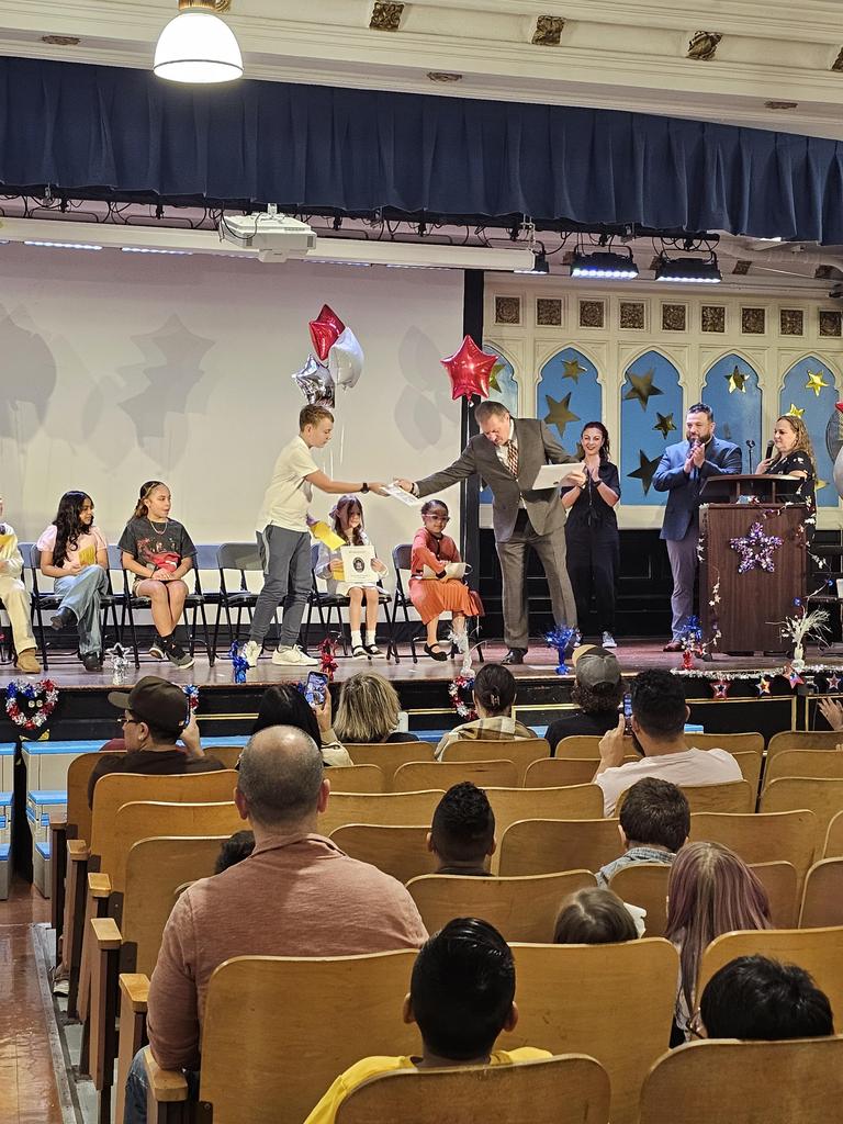 Student receiving their certificate