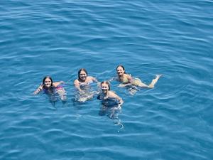 MCS students swim in the ocean in Greece.