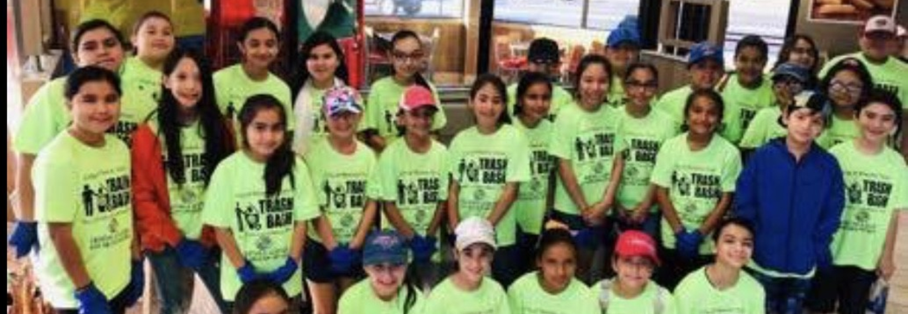group picture of students in green Trash Bash shirts