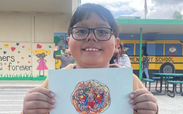 student displaying work
