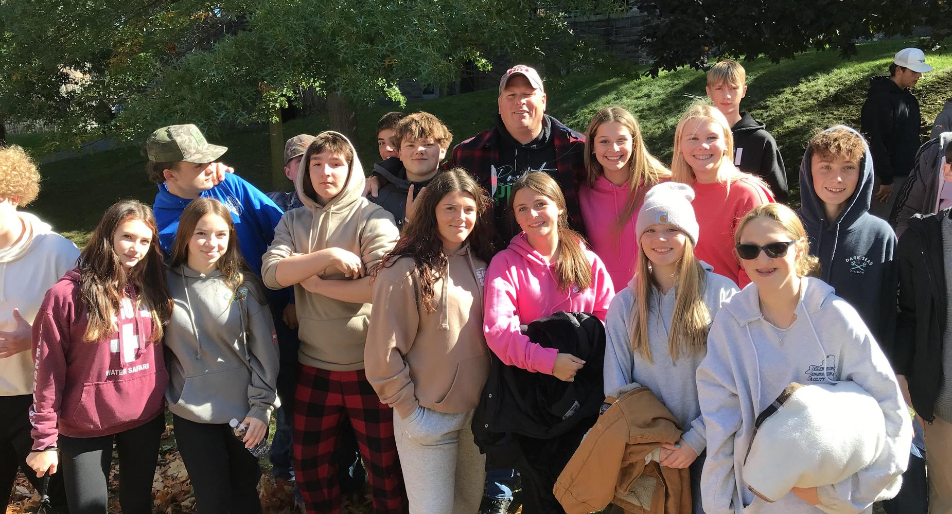 Students smile in a group.