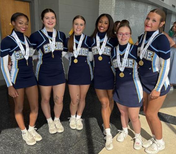 Bruin cheerleaders pose for a group shot.