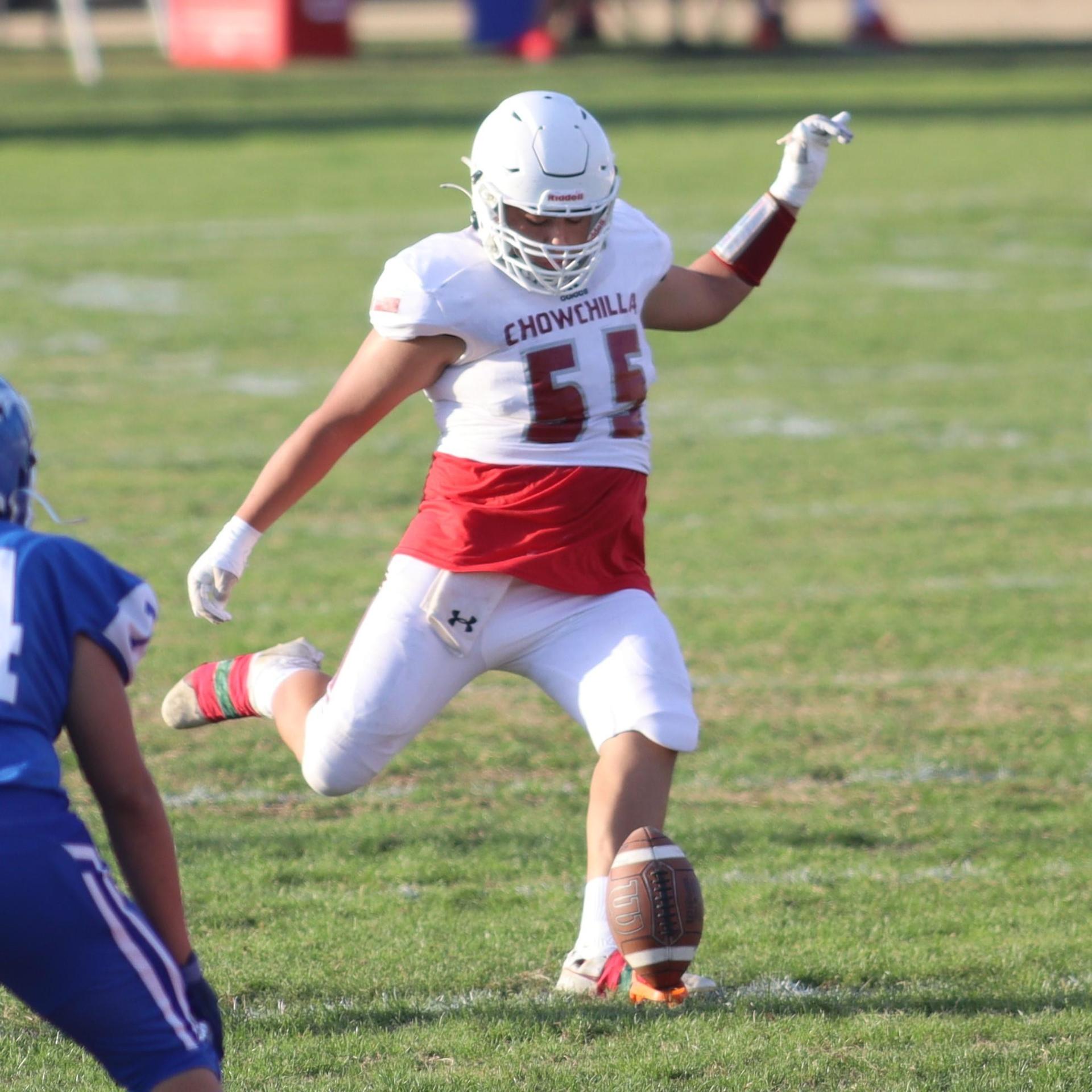 Junior Varsity football players in action against Caruthers