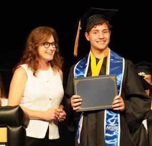 Alexander Frizzell receives the Adam Dipp Memorial Scholarship from Debbie Tomko.