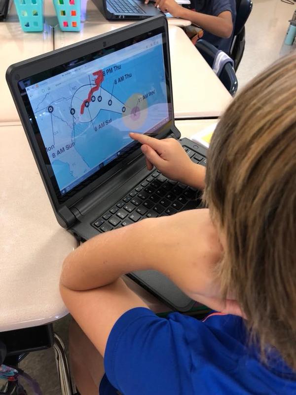 boy looking at computer screen