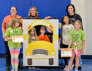 3 staff and students from each grade level being recognized for being driver's of the Month for October