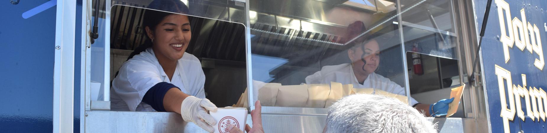 Poly culinary pathway student serves from truckl