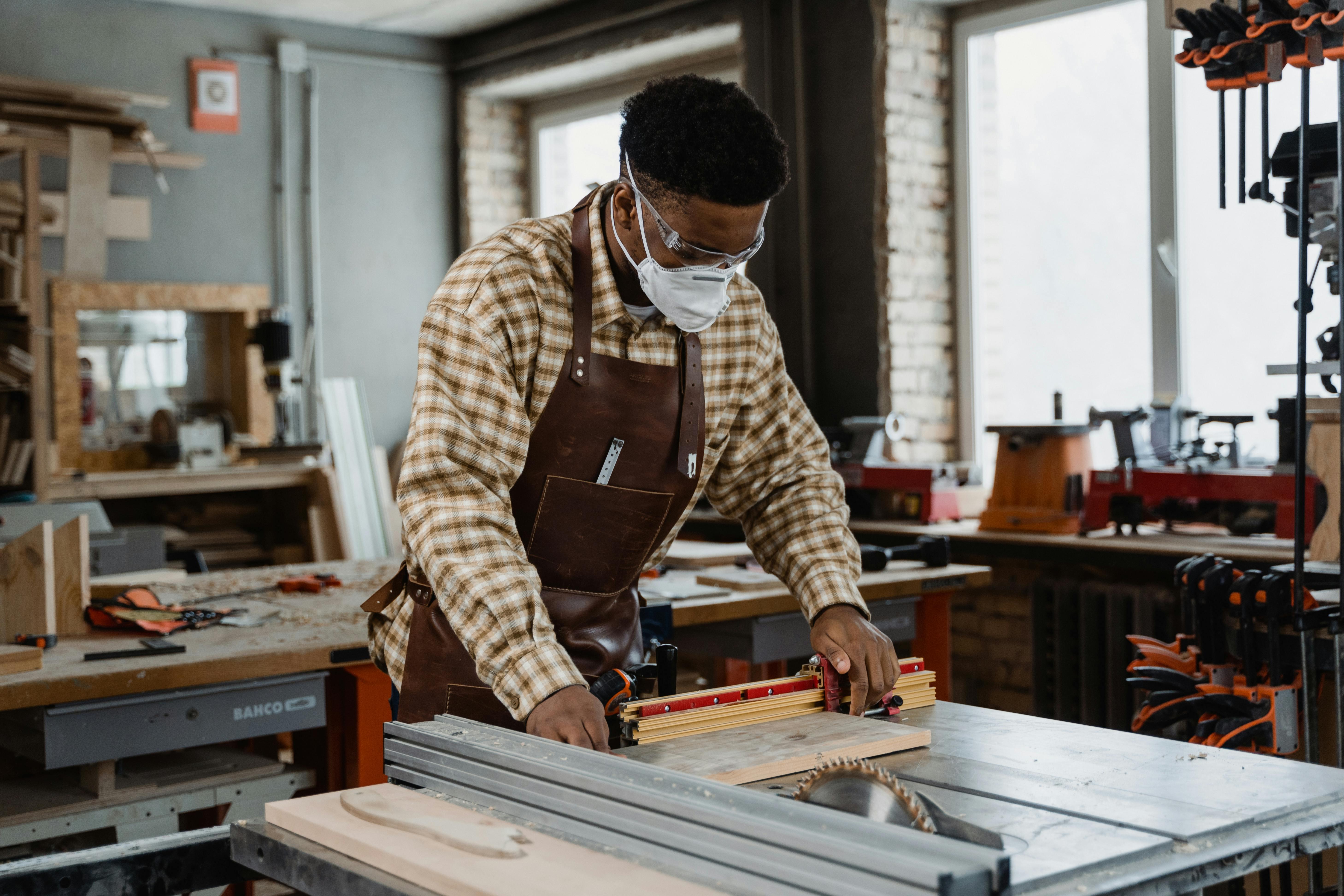 A man using a table saw
