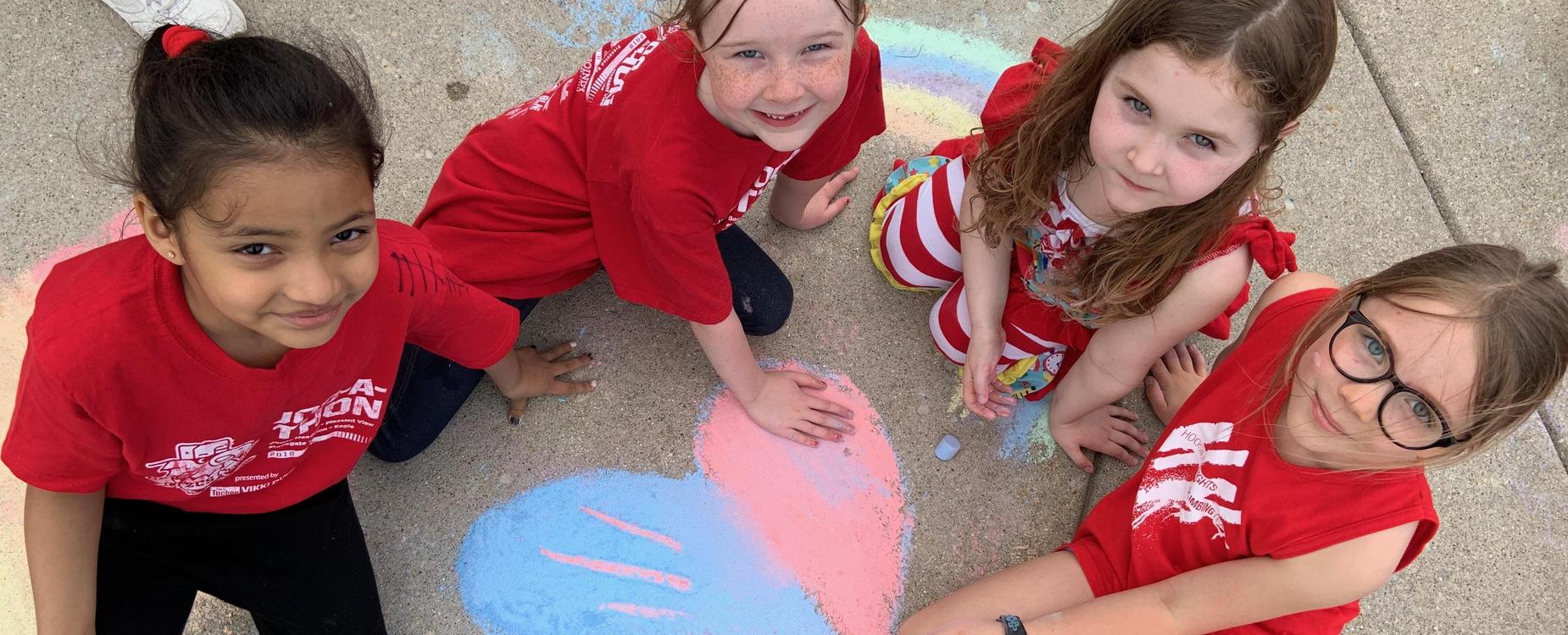 Stonegate students working with chalk on Field Day.