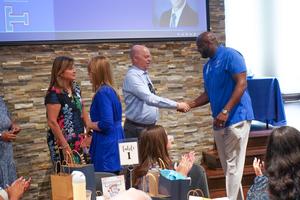 TISD Board Members shake hands with new teachers