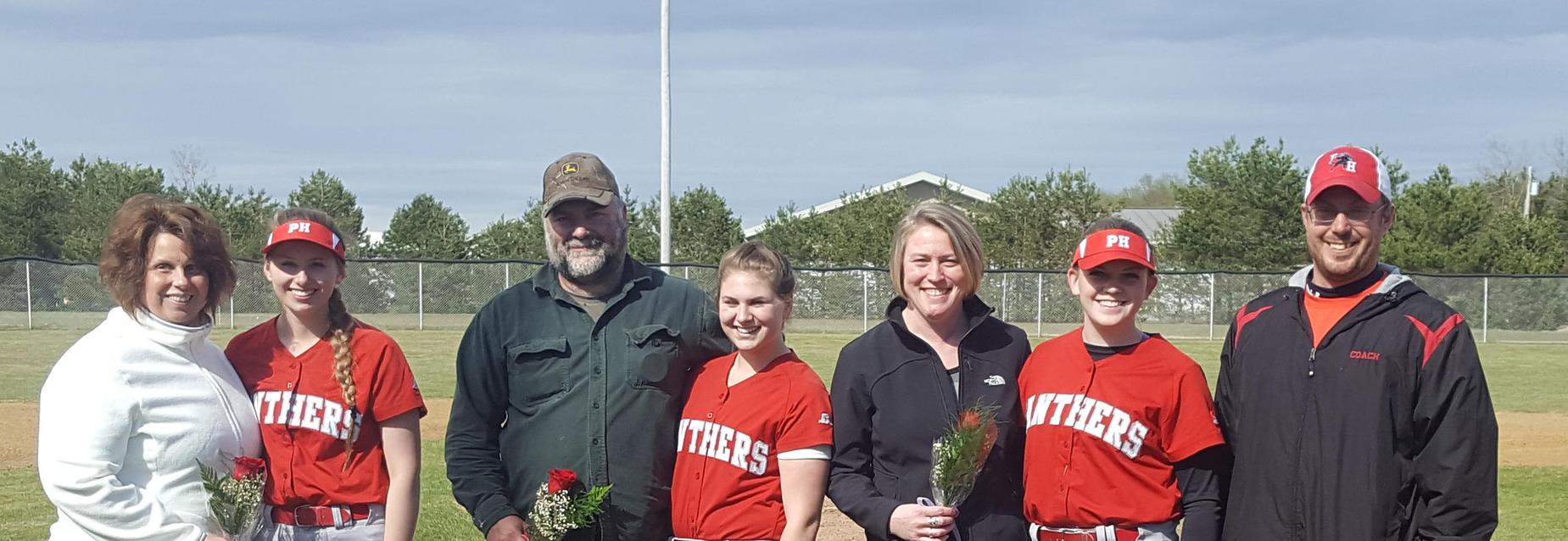 Softball players with their parents & coach