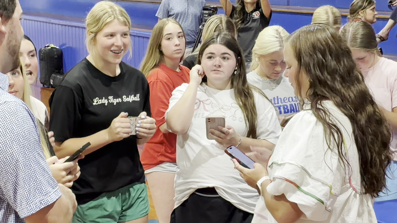 New SEHS softball coach Megan Smith with players during a meet and greet session