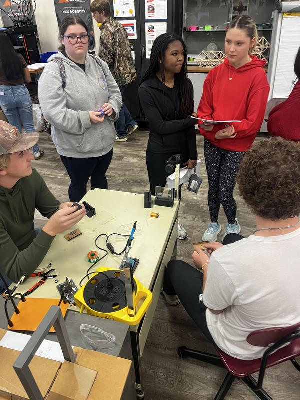 Students demonstrating 3D printing