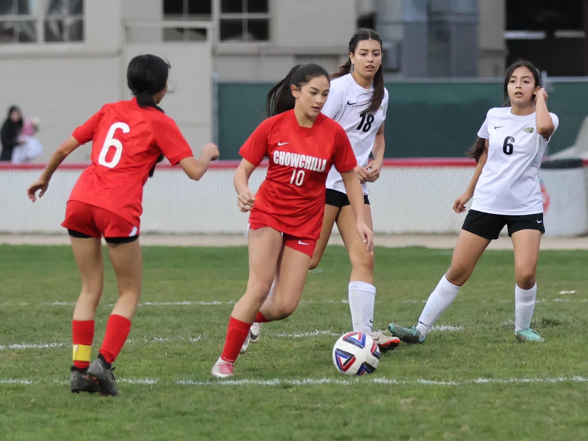 Junior varsity girls playing soccer against liberty