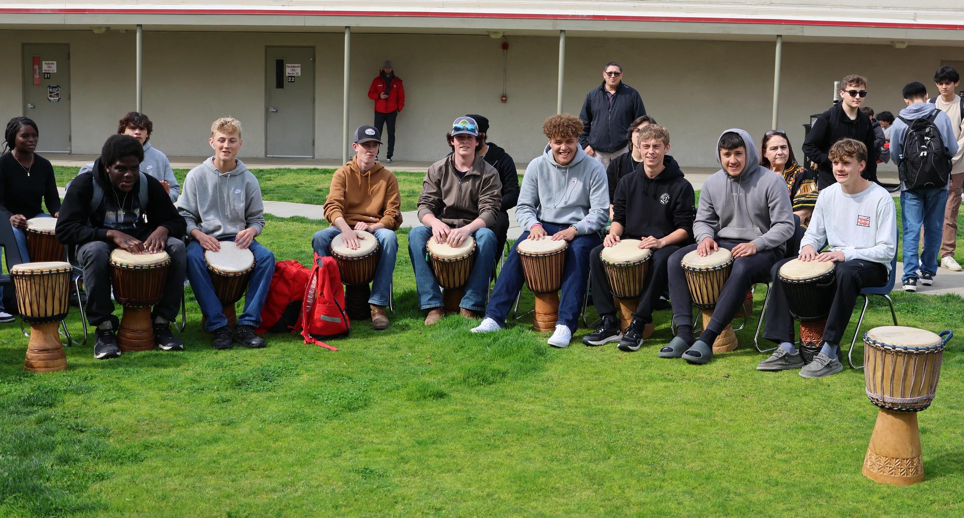 students and staff participating with the African Drum Interactive