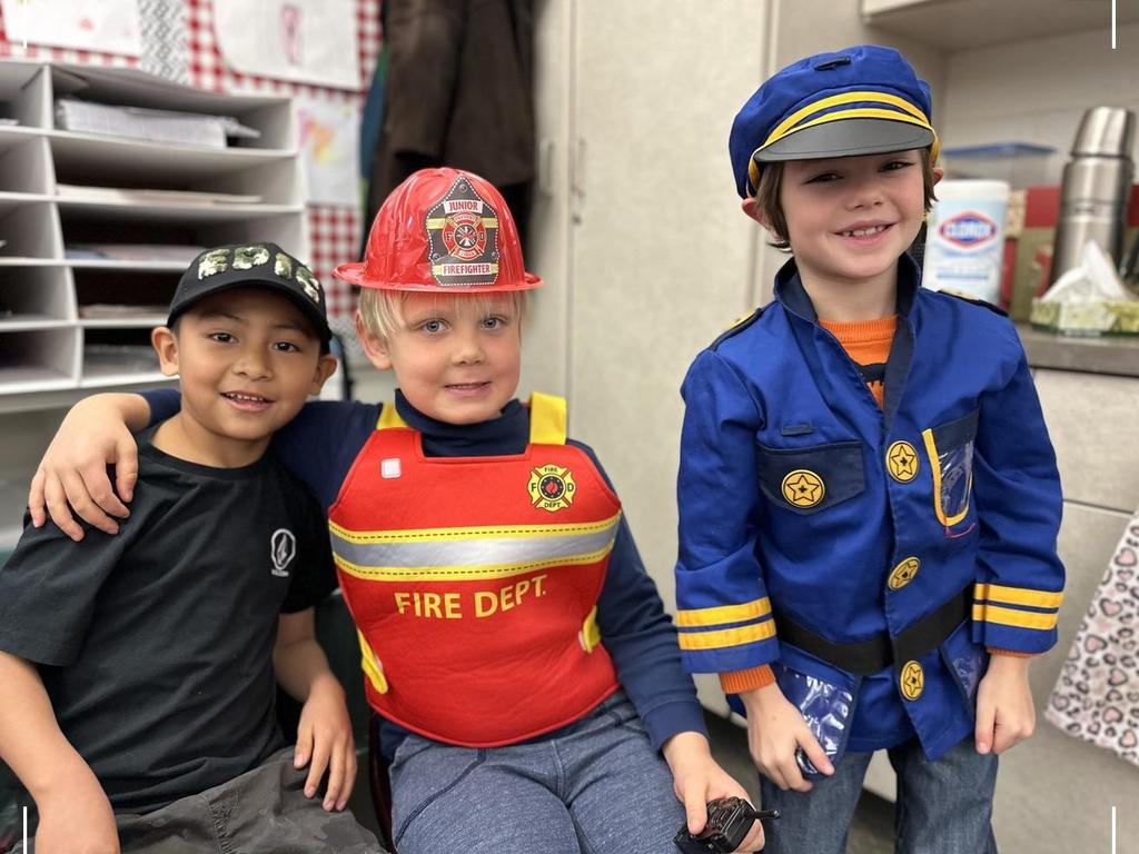 Young children in Halloween costumes.