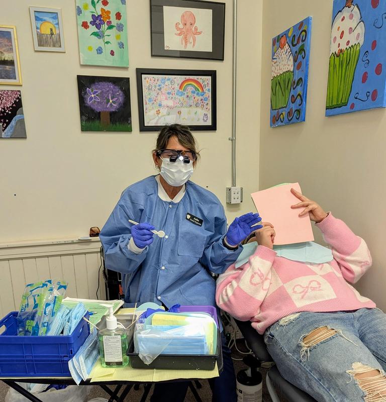 Champion student receiving dental screening