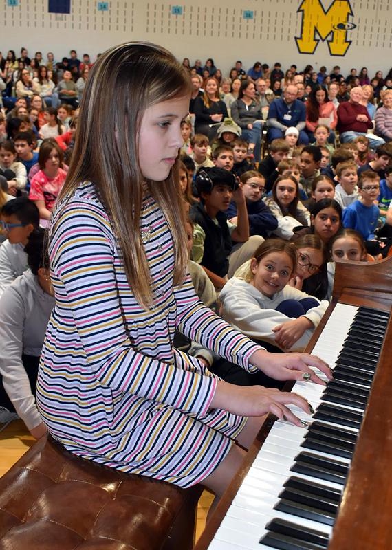 a girl playing the piano