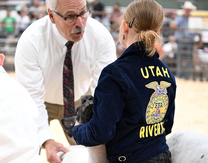Goat and student at livestock show