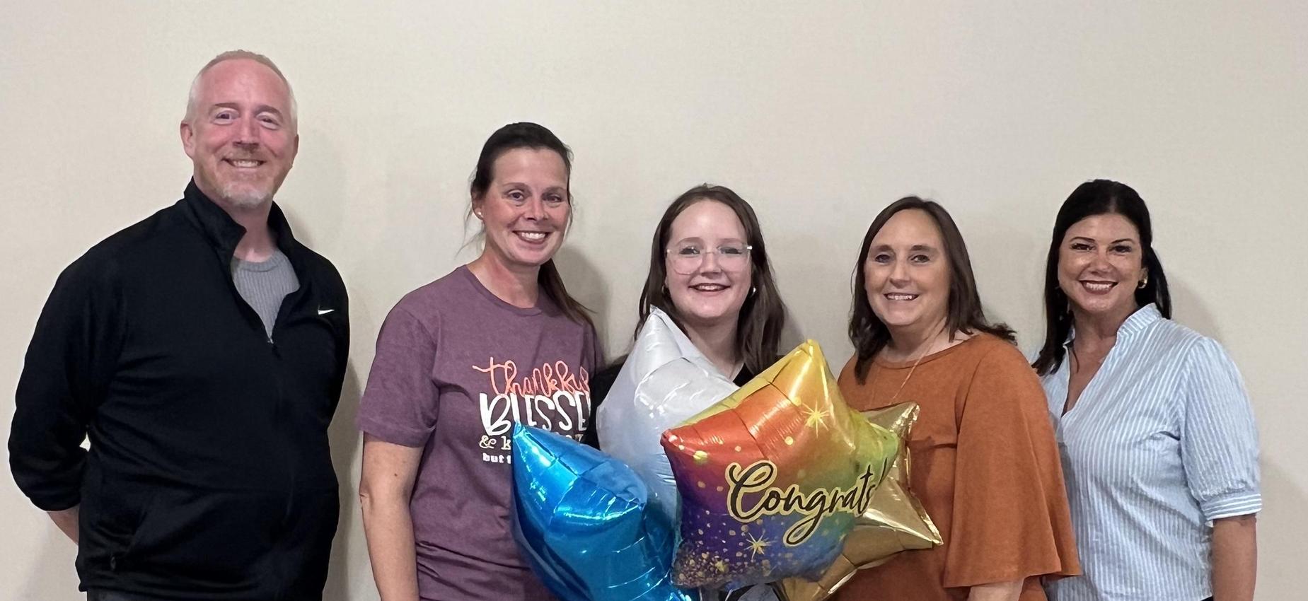 Smiling people with balloons