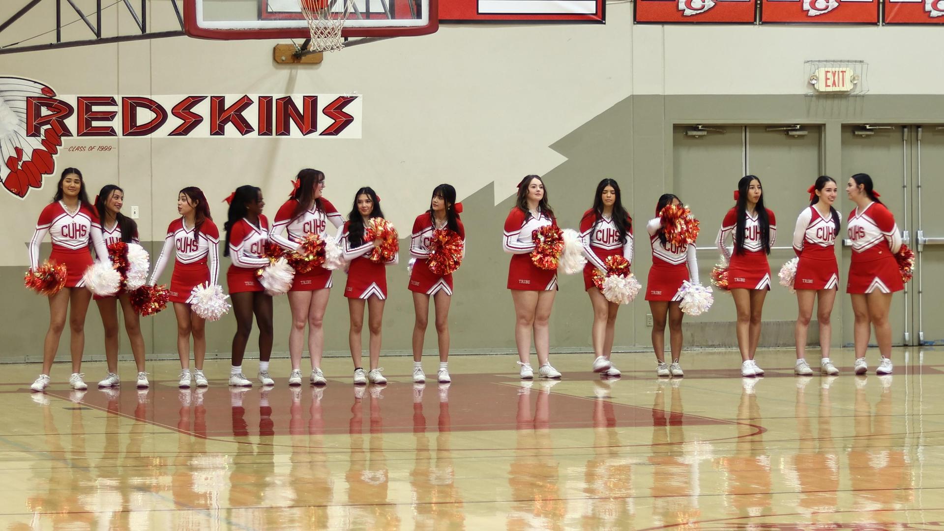 Varsity boys playing basketball against yosemite