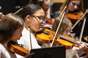 The 6th grade orchestra performs