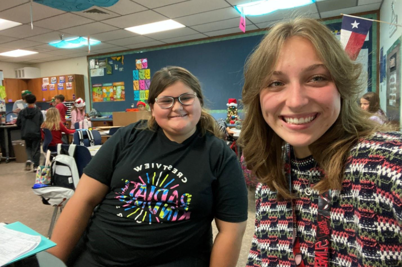 Past photo of Miranda Larson with one of her elementary mentees.