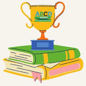 Trophy placed on top of a stack of books.