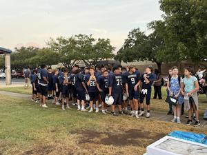 Students stand together during the See You at the Pole prayer gathering.