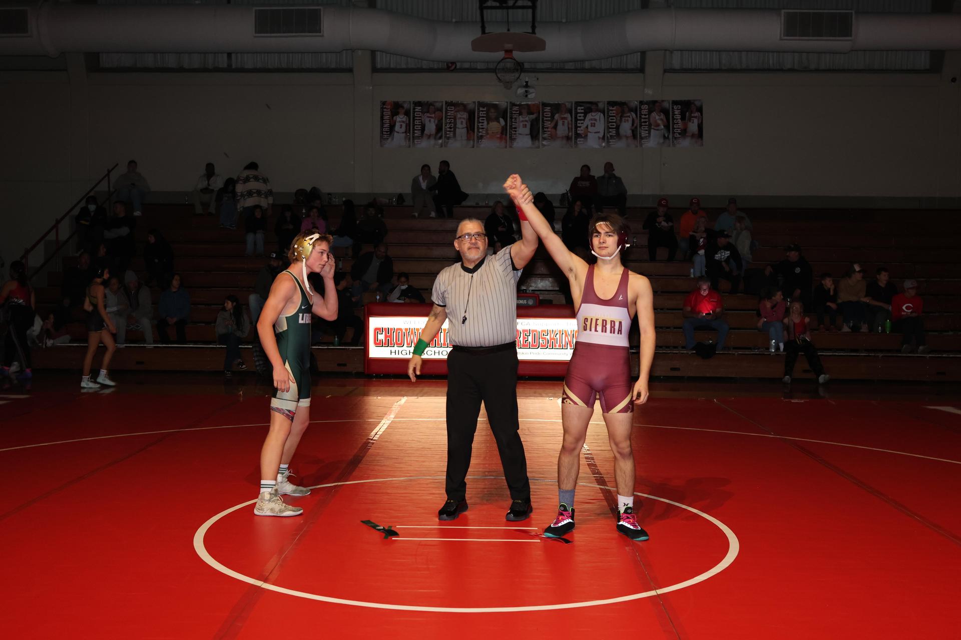 Wrestling winners with hands up 44