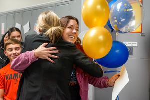Sarah Denning hugging principal Rebecca Whipkey