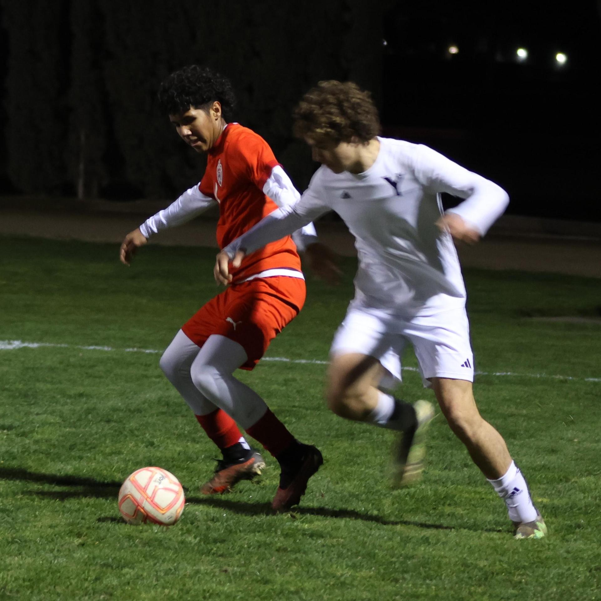 varisty boys soccer playing against yosemite