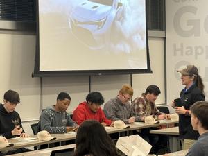 Uzzy with other interns working on papers.