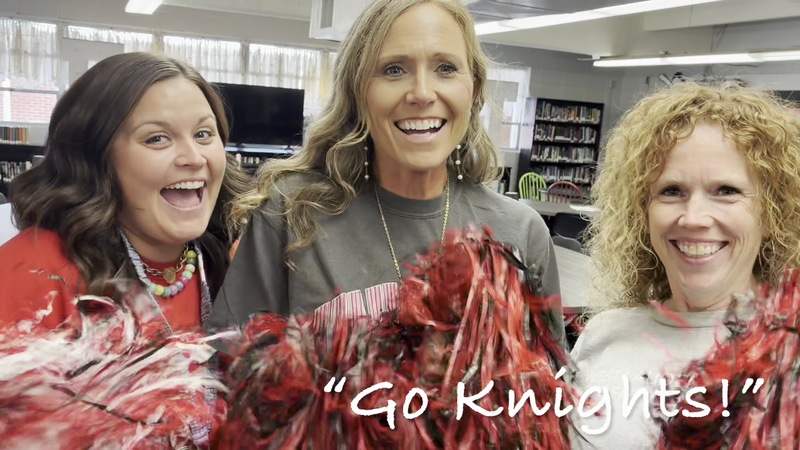 West Lauderdale High School faculty members cheering for the football team