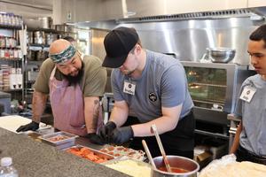Students with Kitchen tABLE learn culinary skills