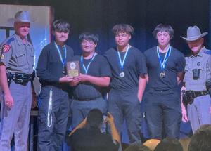 Members of the Temple HS Police Explorer SWAT Team accept their plaque