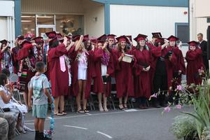 Graduates move their tassel following graduation