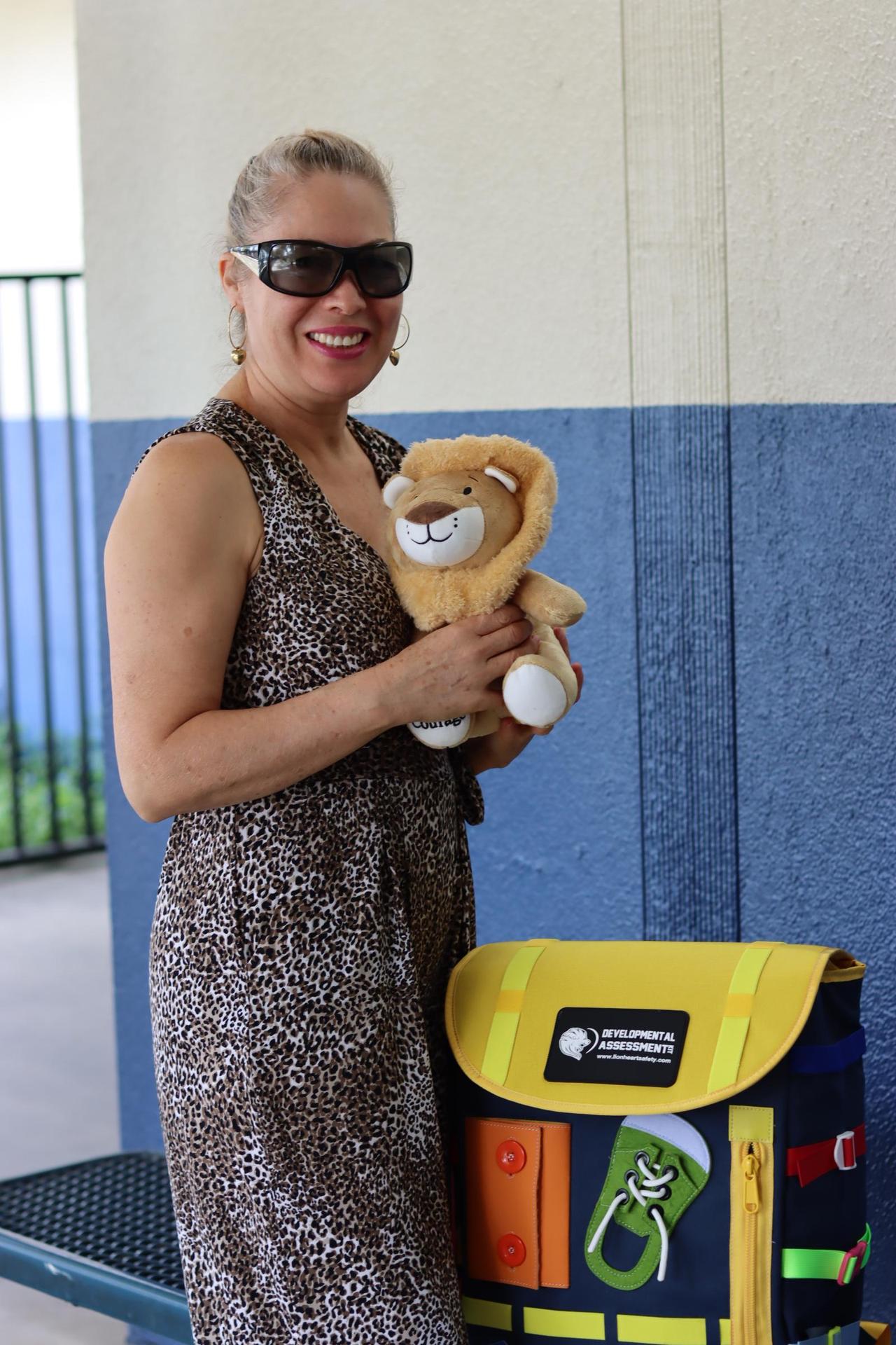 student holding plush