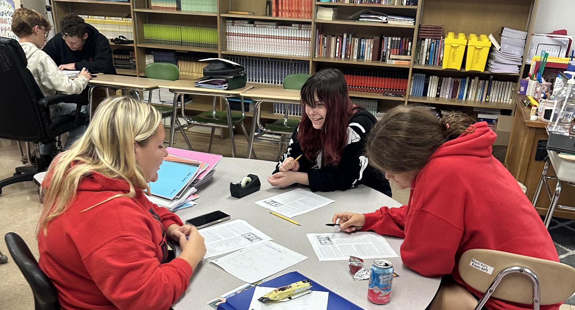 Students work on a class project together.