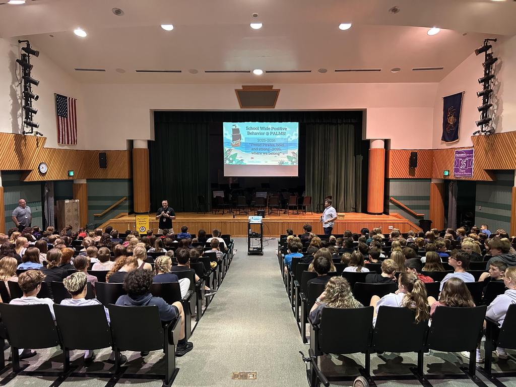 Dr. Scheibenhofer and Dr. Spering giving a presentation to students in the auditorium.