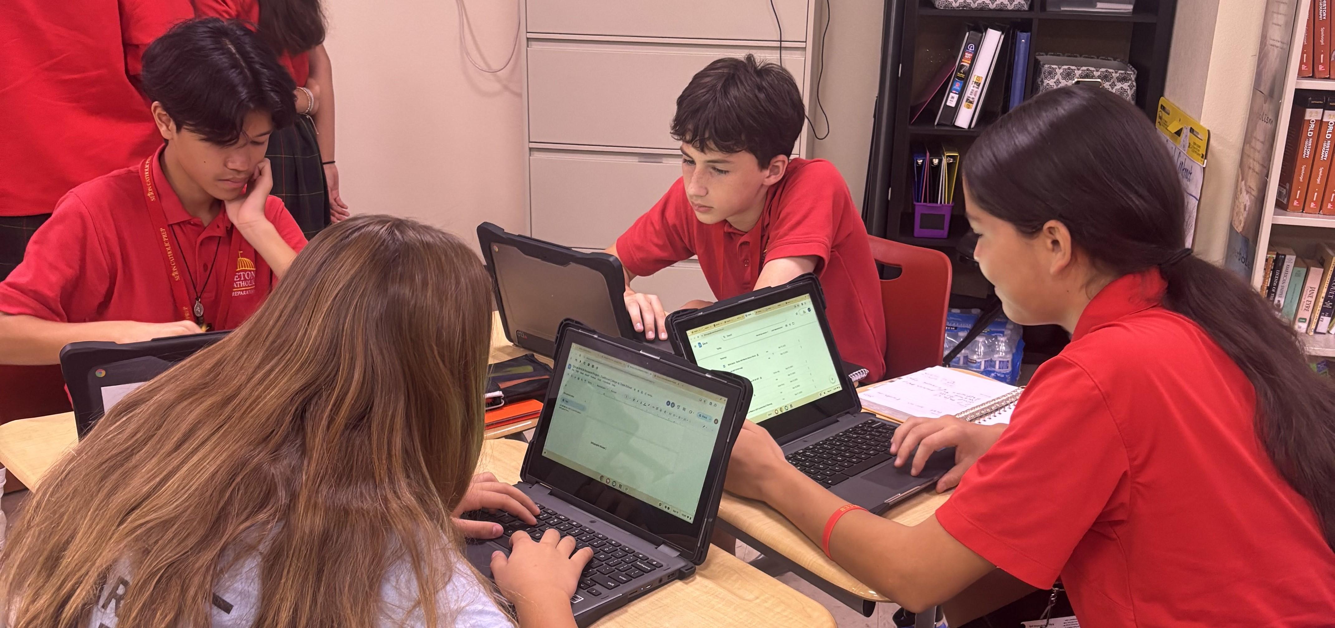 Students working at laptops