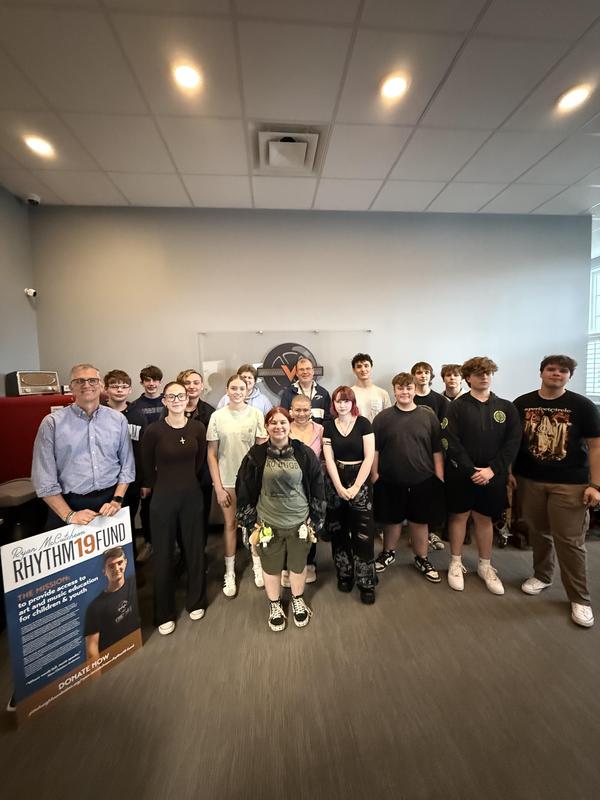 high school students gathered for group picture in recording studio