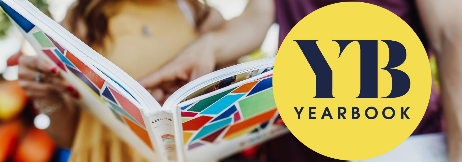 woman holding yearbook