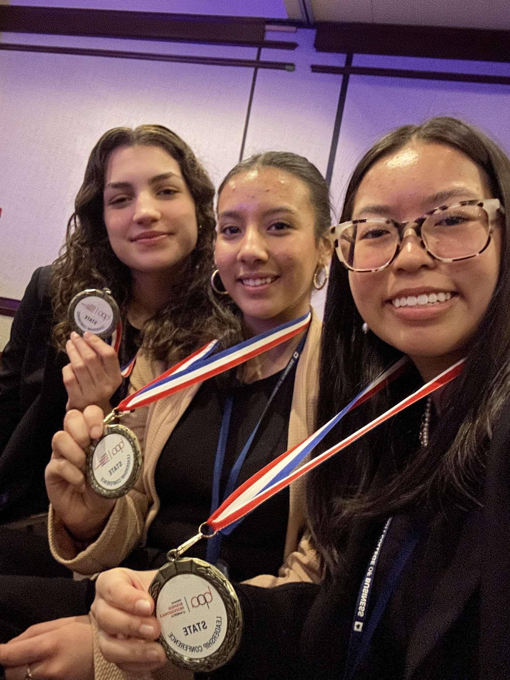 group of students with medals